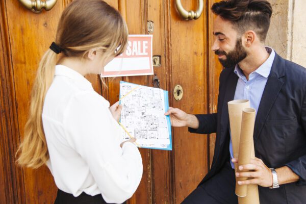 Two Real Estate Agents Checking Closing Documents