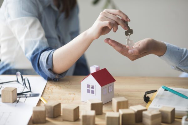 Homebuyer receiving keys to a new house.