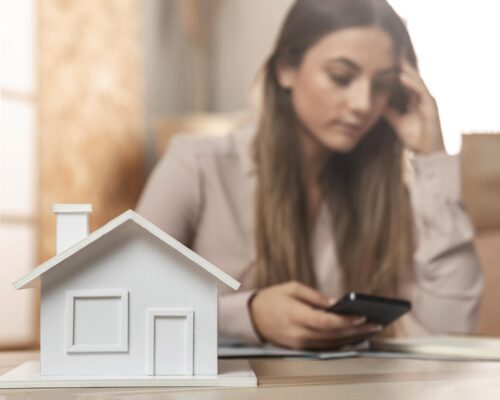 medium shot woman holding phone